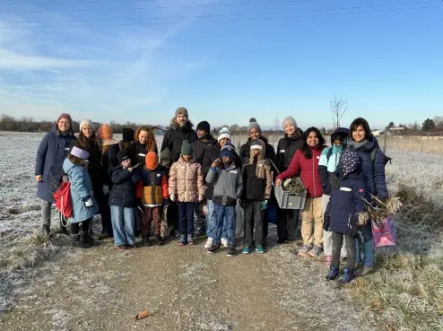 Families gathering natural materials on a hike